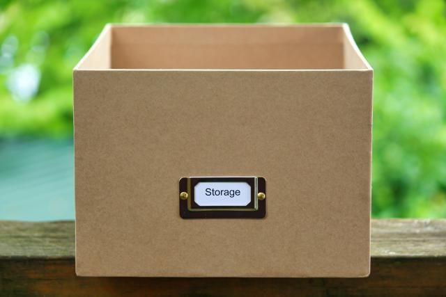 A brown cardboard box labelled with 'storage'